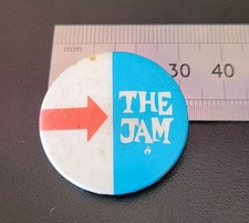 Listing image for Vintage 'THE JAM' Logo Pin Badge Retro Memorabilia Some Wear See Photos